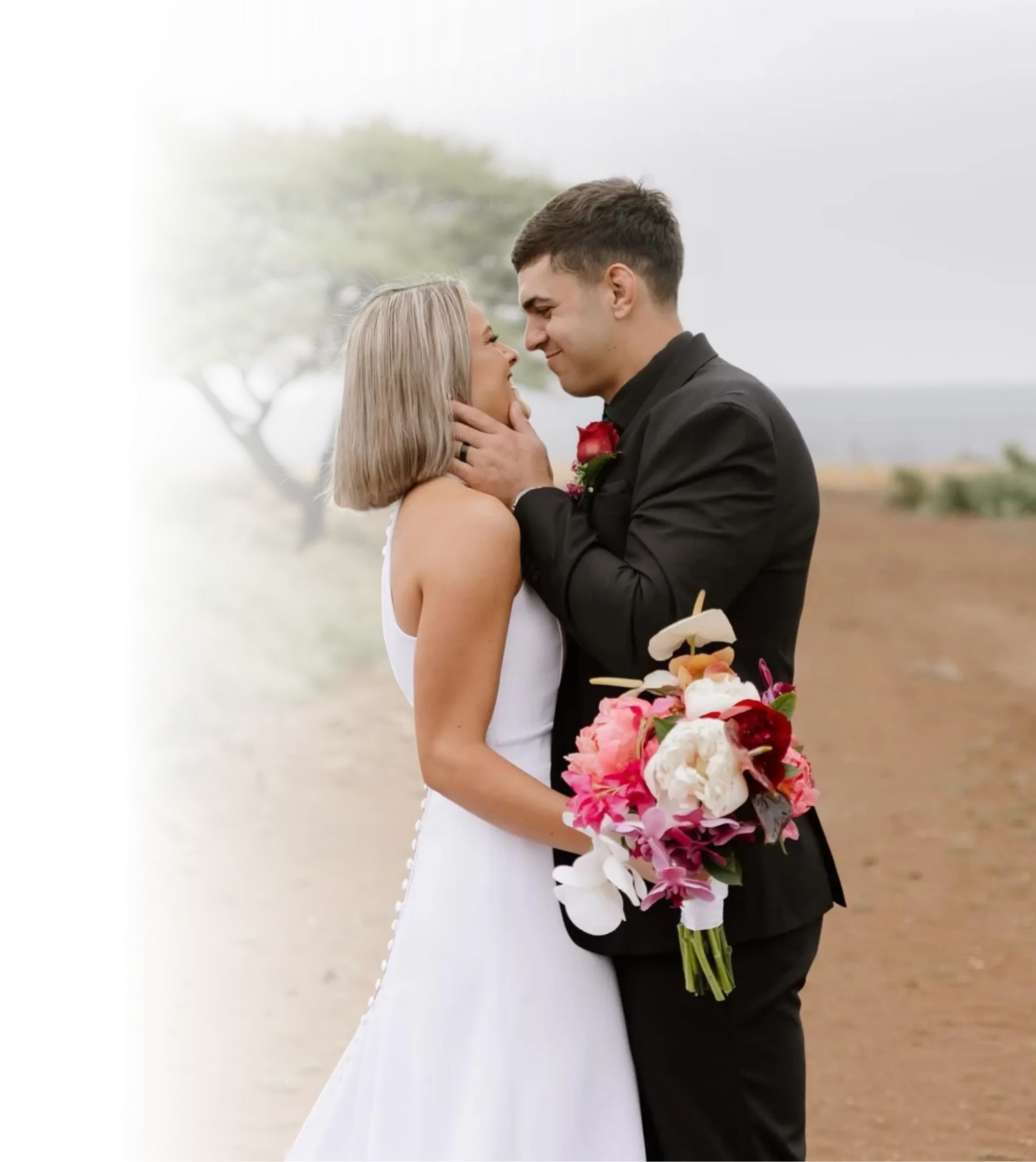 Bride and groom embracing at Bateleur